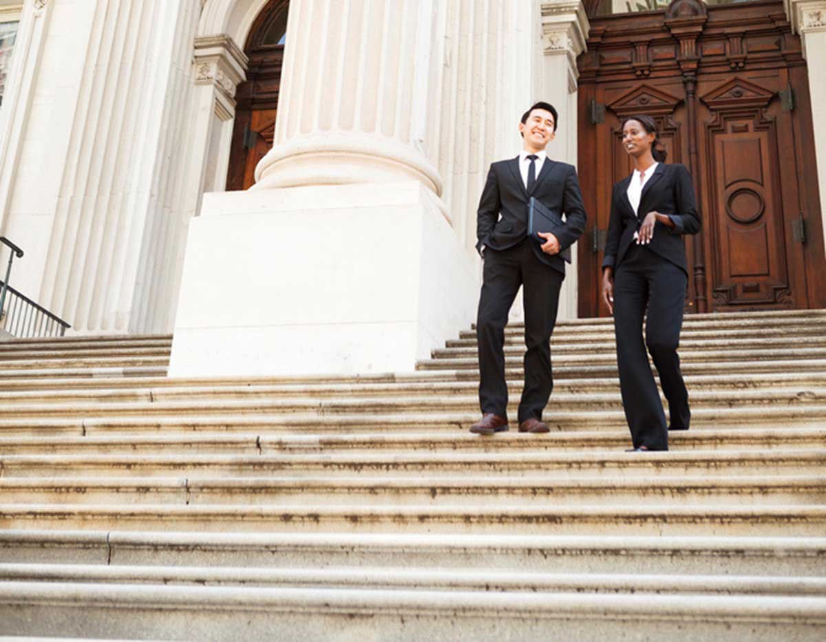 Two Compensation Lawyers Discussing Common Legal Issues Faced by Federal Workers in USA