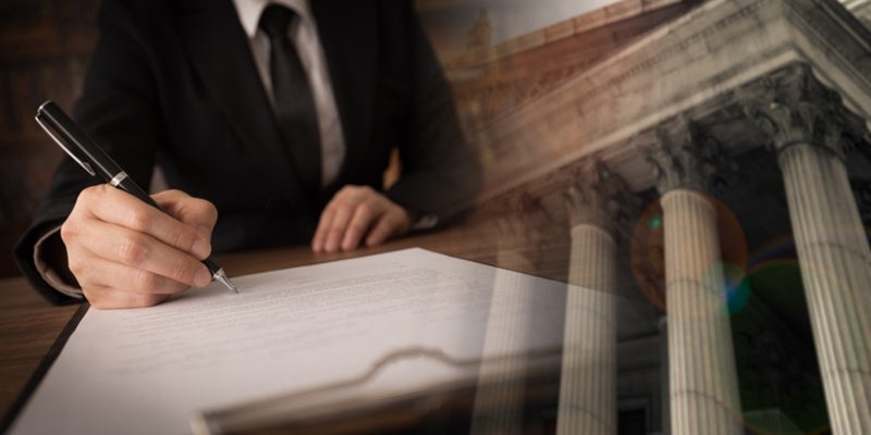 A Compensation Lawyer Inspecting Federal Employees List in USA