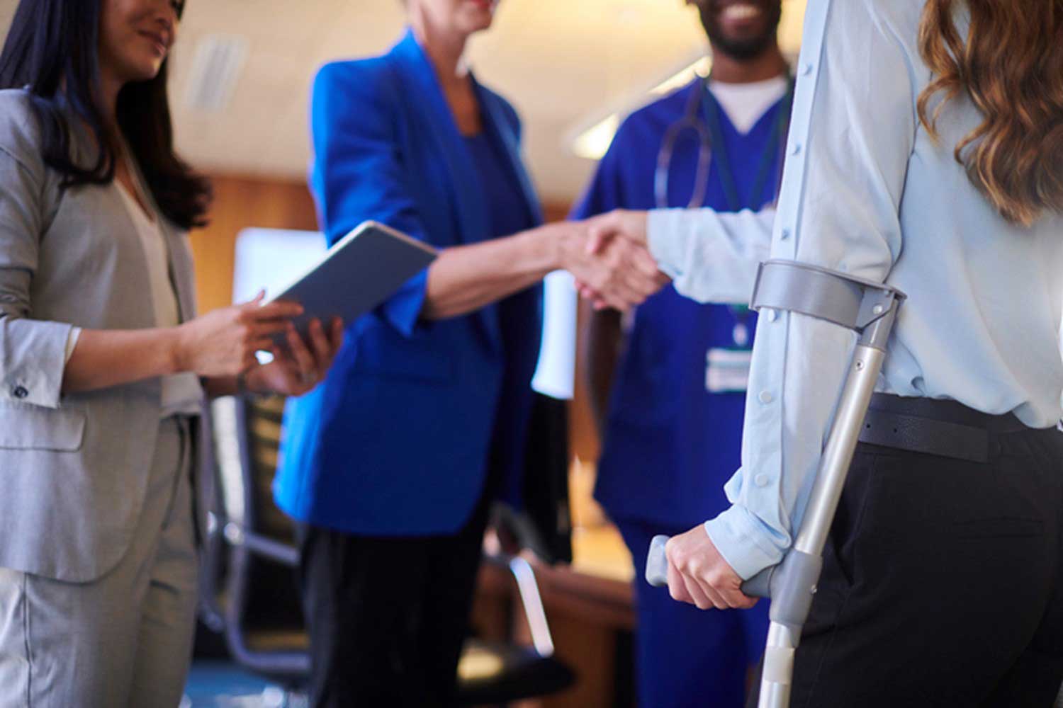 A Doctor Giving a Handshake to an Injured Patient after Federal Compensation in USA