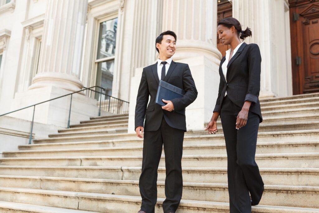 Two lawyers discussing about federal workers compensation benefits in Cherry Hill, NJ 