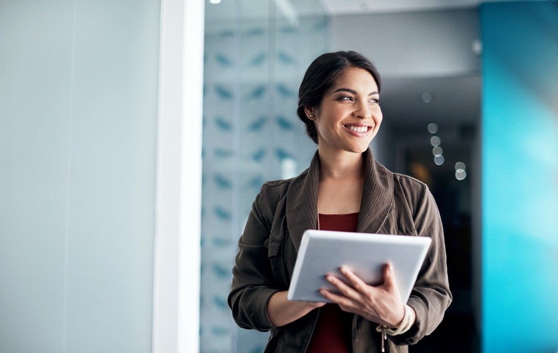 A woman holding a tablet