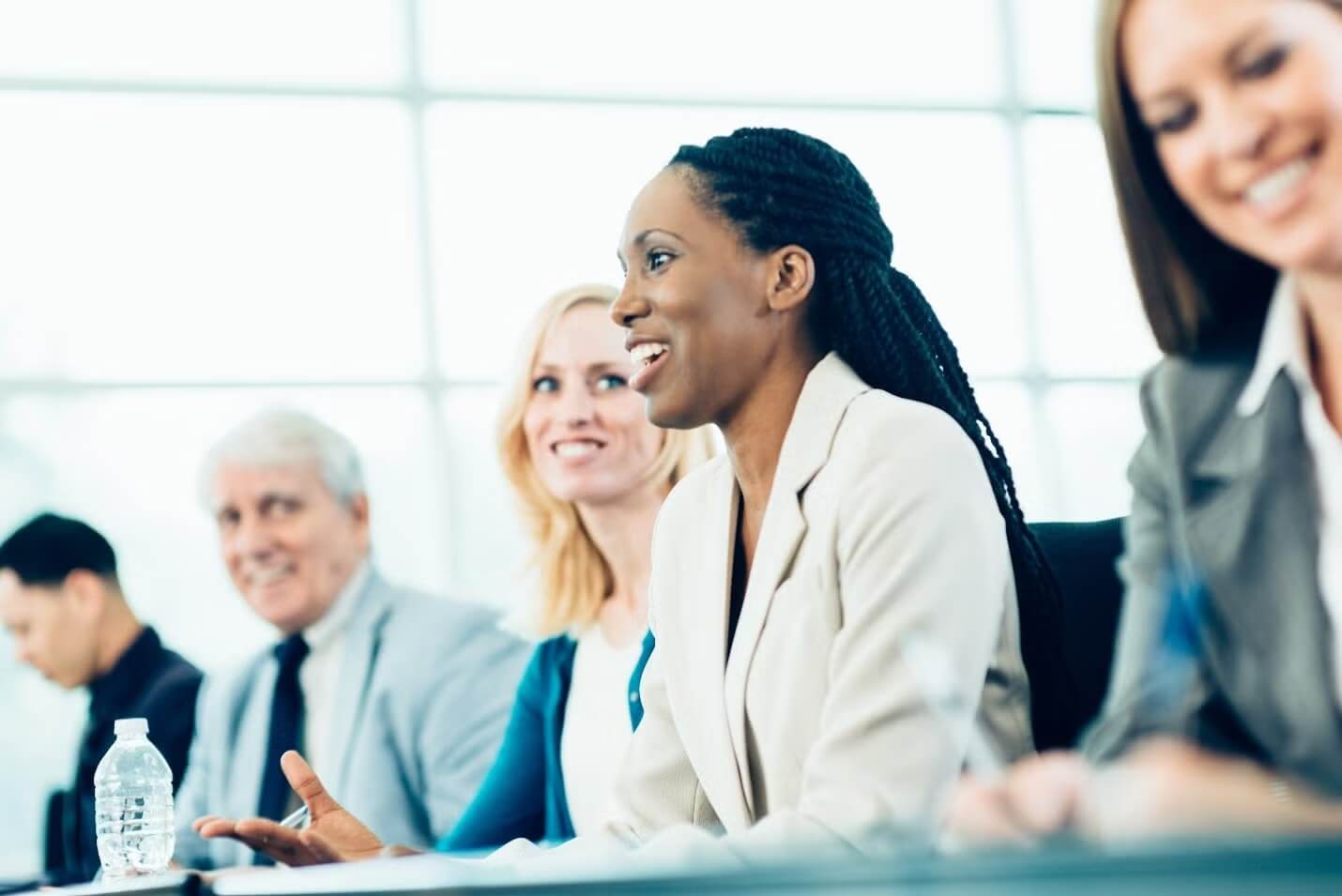 Federal employees engaged in discussion at a conference table in Cherry Hill, NJ