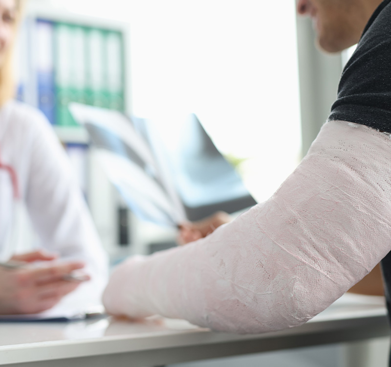 Man with broken arm at doctors office