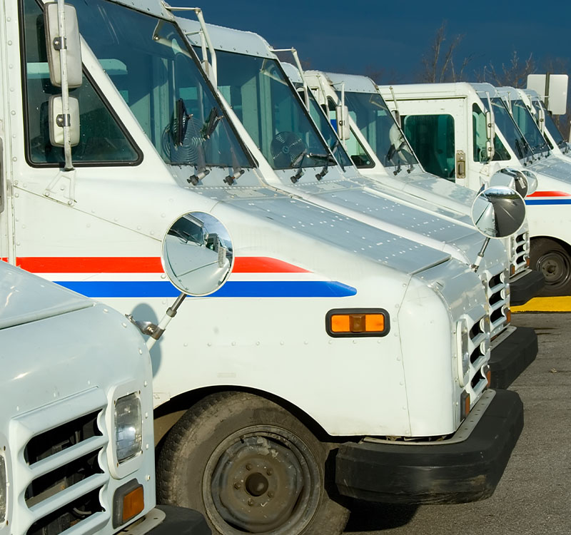 Line of mail trucks ready to go
