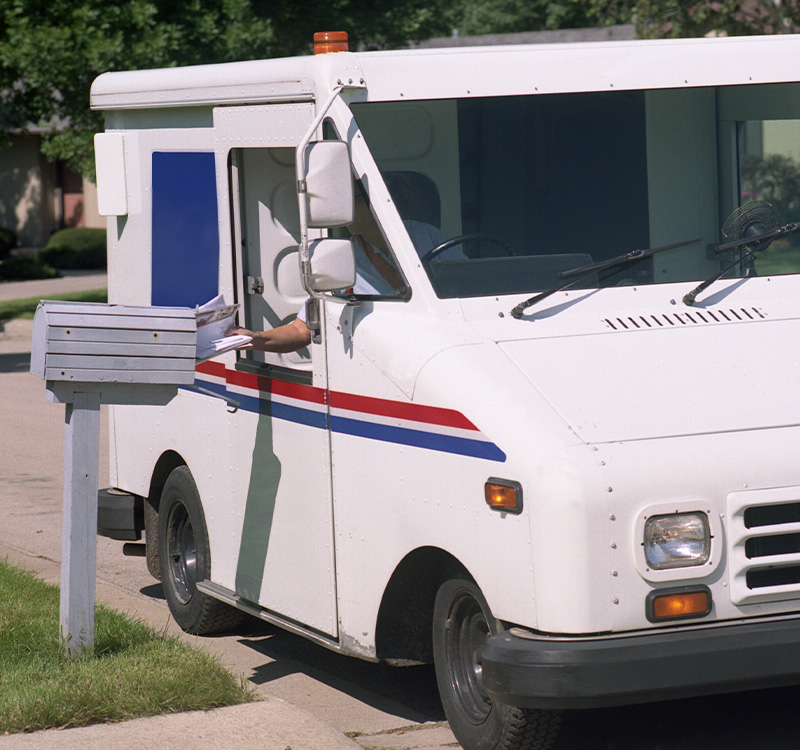 Mail being deliver in a neighborhood