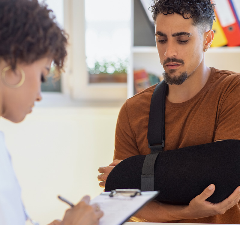 Man with broken arm at doctors office