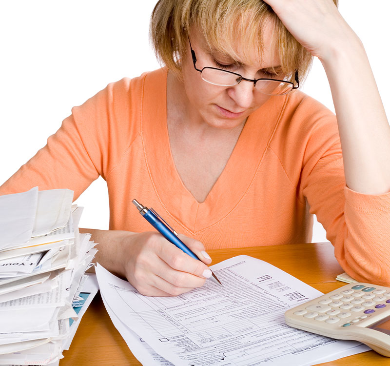A woman over a tax form
