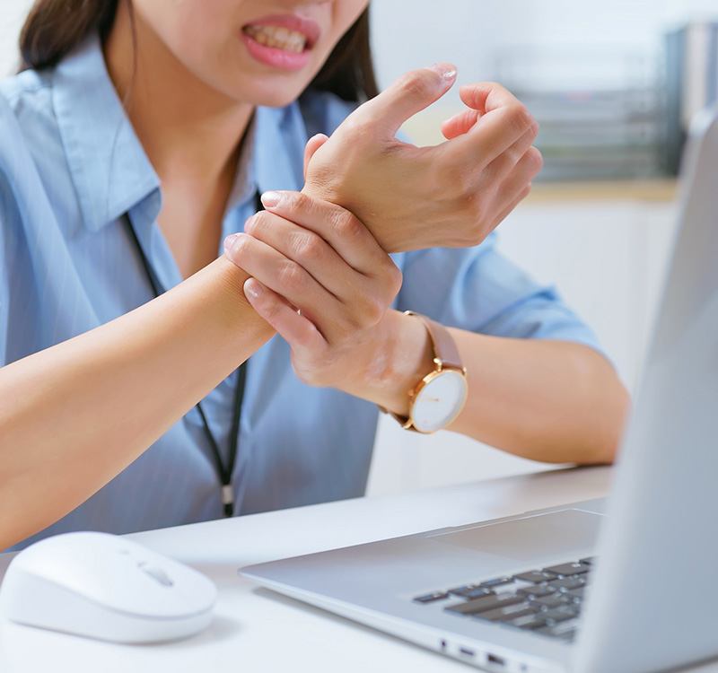 Businesswoman has wrist pain