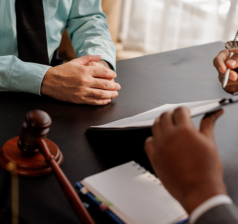Lawyer Legal counsel presents to the client a signed contract