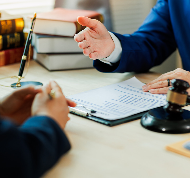 A client meets with a lawyer to discuss a legal case and seek professional representation