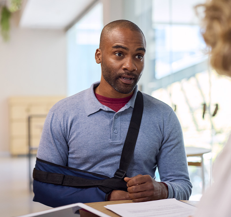 Man with broken arm getting insurance