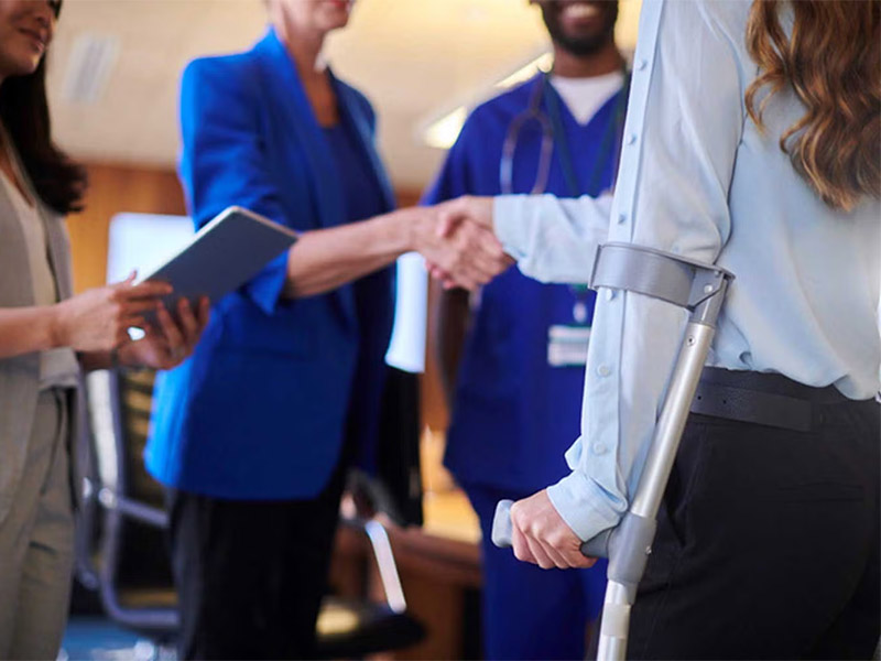 Person with injury attending benefits consultation